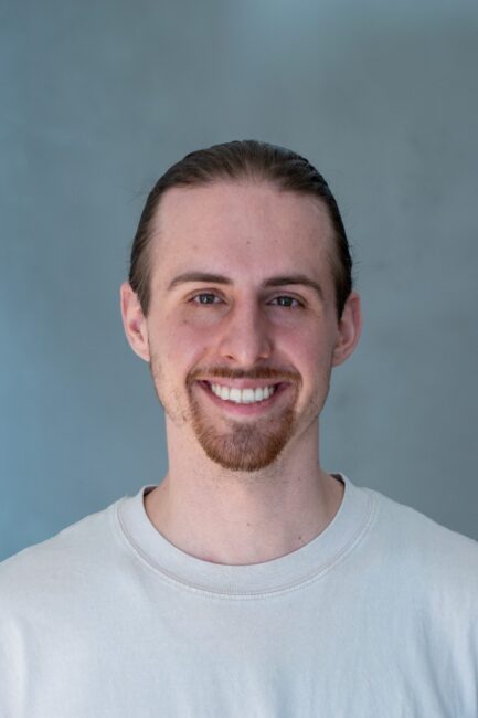 EliasDelueg_Headshot_Friendly EliasDelueg_Headshot_Friendly