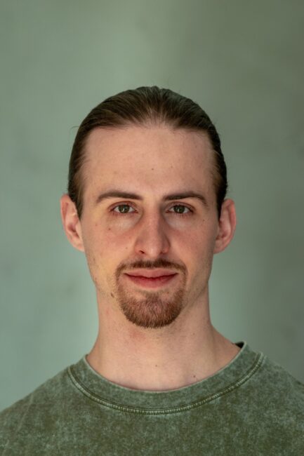 EliasDelueg_Headshot_Neutral EliasDelueg_Headshot_Neutral